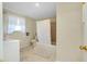 Bathroom featuring tiled floors, shower, and window at 521 Circlewood Dr # Q11, Venice, FL 34293