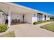 Spacious carport with seating area, offering convenience and extra outdoor living space at 521 Circlewood Dr # Q11, Venice, FL 34293