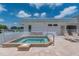 Rooftop hot tub on a sunny day with lounge chairs nearby at 521 Circlewood Dr # Q11, Venice, FL 34293