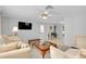 Spacious living room with plush seating, warm lighting, and stylish decor at 521 Circlewood Dr # Q11, Venice, FL 34293