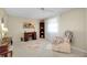 Well-lit living room features carpet, a ceiling fan, and comfortable seating at 521 Circlewood Dr # Q11, Venice, FL 34293