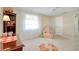 Relaxing living room with carpet, recliner, and natural light through the window at 521 Circlewood Dr # Q11, Venice, FL 34293