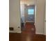 Bathroom with shower, toilet, blue walls and wood floors at 524 S Cervina Dr, Venice, FL 34285