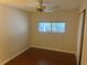 Bedroom with hardwood floors, ceiling fan, and a window with a view at 524 S Cervina Dr, Venice, FL 34285