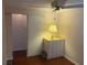 Bedroom featuring hardwood floors and a 6-drawer dresser at 524 S Cervina Dr, Venice, FL 34285