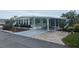 Charming single-story home featuring a covered carport and well-manicured landscaping at 524 S Cervina Dr, Venice, FL 34285