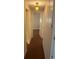 Hallway featuring hardwood floors and decorative light fixture at 524 S Cervina Dr, Venice, FL 34285