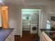 Convenient laundry area with washer, dryer and built in shelving at 524 S Cervina Dr, Venice, FL 34285