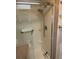 Shower with shelving, hand rails, and shower head with hose in this bathroom at 532 Via Veneto, Venice, FL 34285