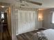 Spacious bedroom with a closet, wood floors, and ample natural light at 532 Via Veneto, Venice, FL 34285