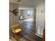 A bright living room with wood-look floors, sliding glass doors, and neutral wall paint at 532 Via Veneto, Venice, FL 34285