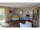 Inviting living area with wood-look flooring, neutral decor, and a sliding glass door at 532 Via Veneto, Venice, FL 34285