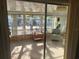 Cozy sunroom with sliding glass doors and plenty of natural light at 532 Via Veneto, Venice, FL 34285