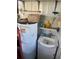 Utility room with a water heater and sink at 532 Via Veneto, Venice, FL 34285