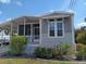 Charming single-story home featuring a screened-in porch and well-maintained landscaping at 601 Club House Rd, Venice, FL 34285