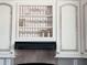 Detailed kitchen cabinetry with stylish hardware and glass display shelves at 601 Club House Rd, Venice, FL 34285