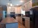 Well-equipped kitchen with ample cabinet space and sleek black appliances at 601 Club House Rd, Venice, FL 34285