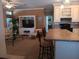 Open-concept living room with a blend of kitchen island and inviting seating area at 601 Club House Rd, Venice, FL 34285