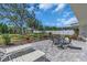 Large backyard patio perfect for relaxation in the shade on a sunny day at 605 Valencia Rd, Venice, FL 34285