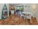Dining area with access to the lanai and a view of the kitchen at 613 Sugarwood Dr, Venice, FL 34292
