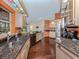 Bright kitchen with granite countertops, modern appliances, and a convenient double sink overlooking an adjacent dining area at 613 Sugarwood Dr, Venice, FL 34292
