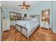 Charming bedroom features warm tile floors, stylish decor, and a spacious layout with natural light at 613 Sugarwood Dr, Venice, FL 34292