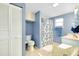 Bathroom with closet, white toilet, shower and blue accents at 616 Circlewood Dr # S2-14, Venice, FL 34293