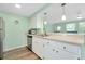 Kitchen with updated appliances, stainless steel sink, and view of living space at 616 Circlewood Dr # S2-14, Venice, FL 34293