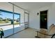 A view from the lanai shows the screened enclosure and adjacent interior door at 616 Circlewood Dr # S2-14, Venice, FL 34293