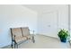 A view of the screened lanai shows a bench, closet and potted plant at 616 Circlewood Dr # S2-14, Venice, FL 34293
