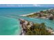 Scenic aerial view of the coastline, capturing the sparkling turquoise waters and white sandy beaches at 632 Golf Dr # 632, Venice, FL 34285