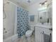 Clean bathroom featuring shower-tub, a framed mirror, and modern fixtures at 632 Golf Dr # 632, Venice, FL 34285