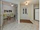 Inviting entryway flows into a living room area, showcasing tiled floors and a light, airy feel at 632 Golf Dr # 632, Venice, FL 34285
