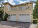 Two-story home featuring multi-car garage, neutral paint, and well-maintained landscaping at 632 Golf Dr # 632, Venice, FL 34285