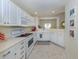 Bright kitchen with white cabinets, modern appliances, and open layout at 632 Golf Dr # 632, Venice, FL 34285