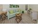 Comfortable living room with stylish decor, bright colors, and plenty of natural light at 632 Golf Dr # 632, Venice, FL 34285