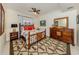 Inviting main bedroom with rich wood furniture, a ceiling fan, and neutral walls at 632 Golf Dr # 632, Venice, FL 34285