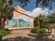 The Venice Theatre displays a picturesque outdoor mural, enhanced by a water feature and lush greenery at 632 Golf Dr # 632, Venice, FL 34285