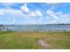 The expansive backyard offers direct access to the waterfront at 704 Laguna Dr, Venice, FL 34285