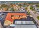 Aerial view showcasing the complex with its unique layout, landscaping, and parking areas at 720 Apalachicola Rd # 104, Venice, FL 34285