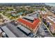 Aerial view highlighting the building, covered parking, and surrounding neighborhood at 720 Apalachicola Rd # 104, Venice, FL 34285