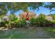 Venice Art Center with landscaped garden, red sculpture and beautiful surrounding greenery at 720 Apalachicola Rd # 104, Venice, FL 34285