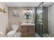 Modern bathroom featuring a granite-look vanity and a step-in shower with a glass door at 720 Apalachicola Rd # 104, Venice, FL 34285