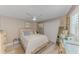 Comfortable bedroom featuring a ceiling fan, light-colored walls, and wood-look floors at 720 Apalachicola Rd # 104, Venice, FL 34285