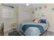 Comfortable bedroom with shuttered windows, a ceiling fan, and neutral colored walls at 720 Apalachicola Rd # 104, Venice, FL 34285