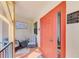 Inviting front porch with cozy seating area, unit directory, and bright front door at 720 Apalachicola Rd # 104, Venice, FL 34285