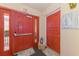Interior hallway featuring neutral decor, unit entry, and tiled flooring at 720 Apalachicola Rd # 104, Venice, FL 34285