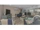 Comfortable living room featuring modern furnishings and a calming, nautical theme at 720 Apalachicola Rd # 104, Venice, FL 34285