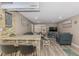 Inviting living room featuring coastal decor, neutral tones, and hardwood floors at 720 Apalachicola Rd # 104, Venice, FL 34285