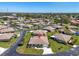 Well-manicured neighborhood with residential homes, mature landscaping, and quiet streets at 761 Vivienda South Ct # 14, Venice, FL 34293